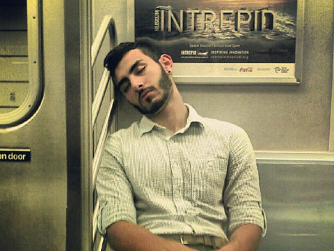 man-sleeping-train-flickr-david_shankbone